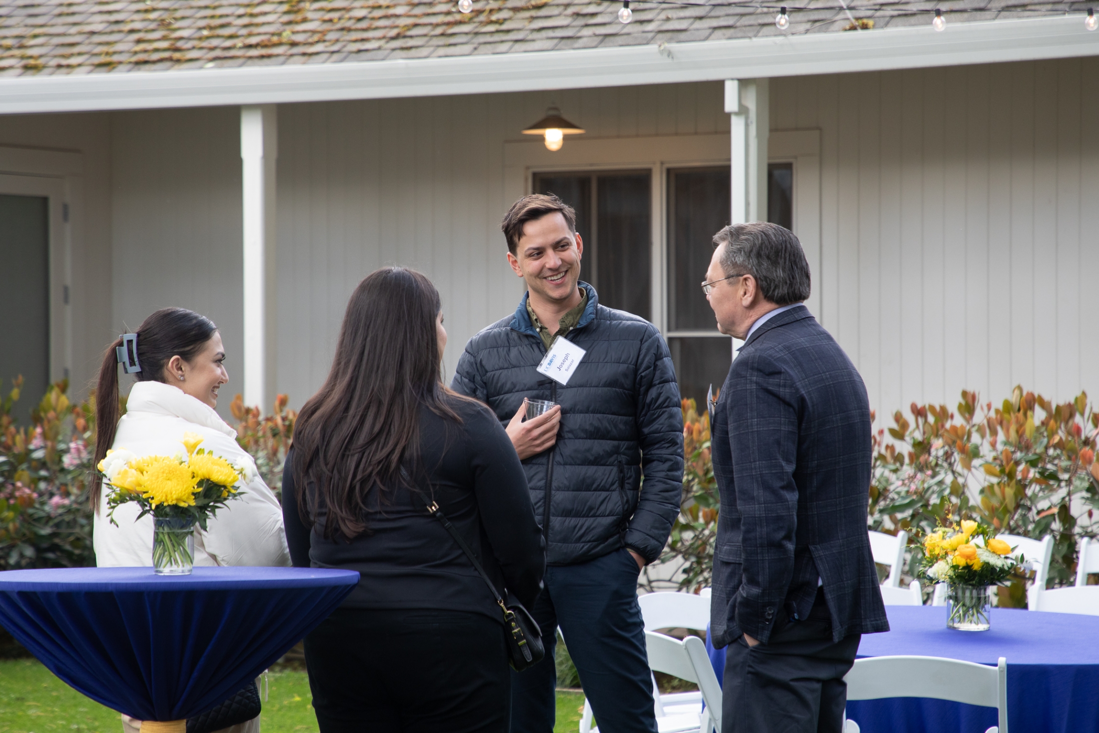 Dean Kevin Johnson speaking with admitted students at the Chancellor's Residence. 