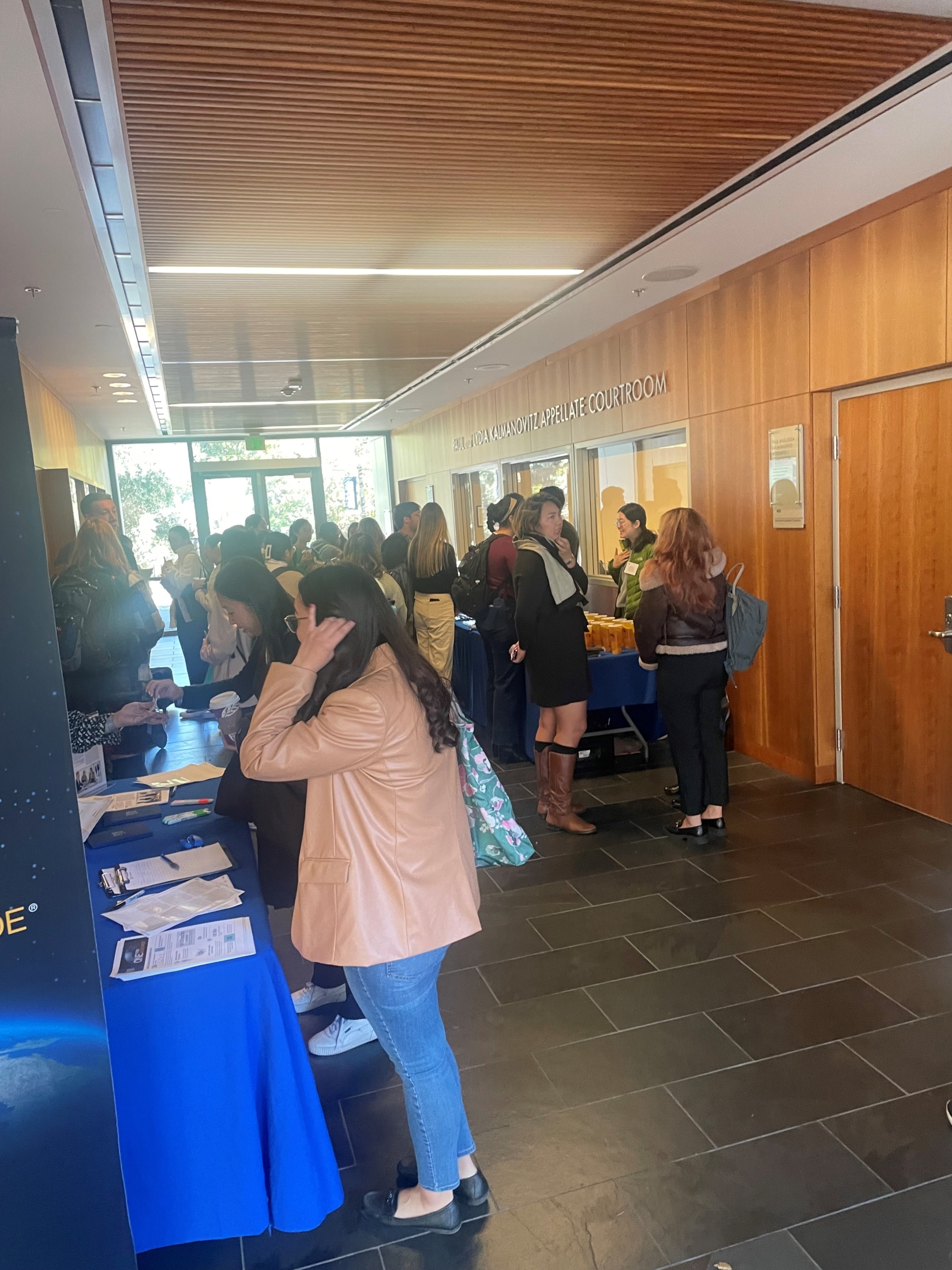 Law students networking at an informational session on campus.