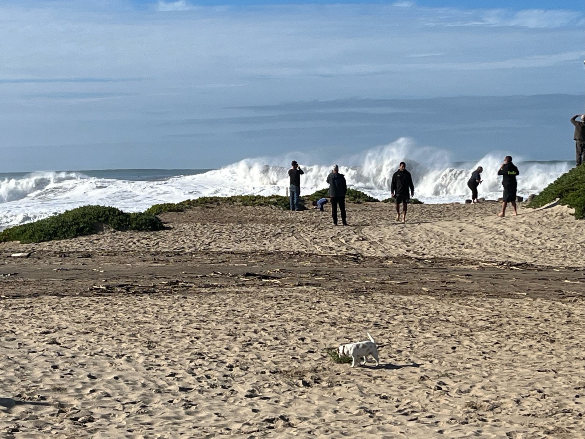 Waves crashing against a sandy beach. 