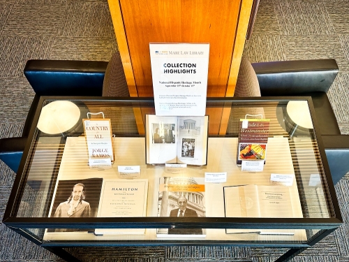 Glass display case with books