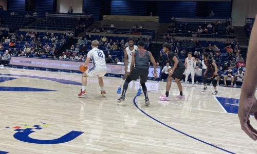 University of the Pacific men's basketball players defend a UC Davis players. 