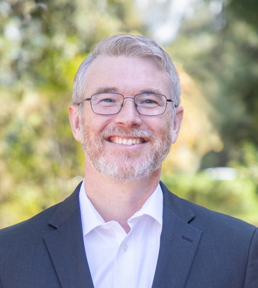 UC Davis Law Professor Karrigan Bork smiling outside.